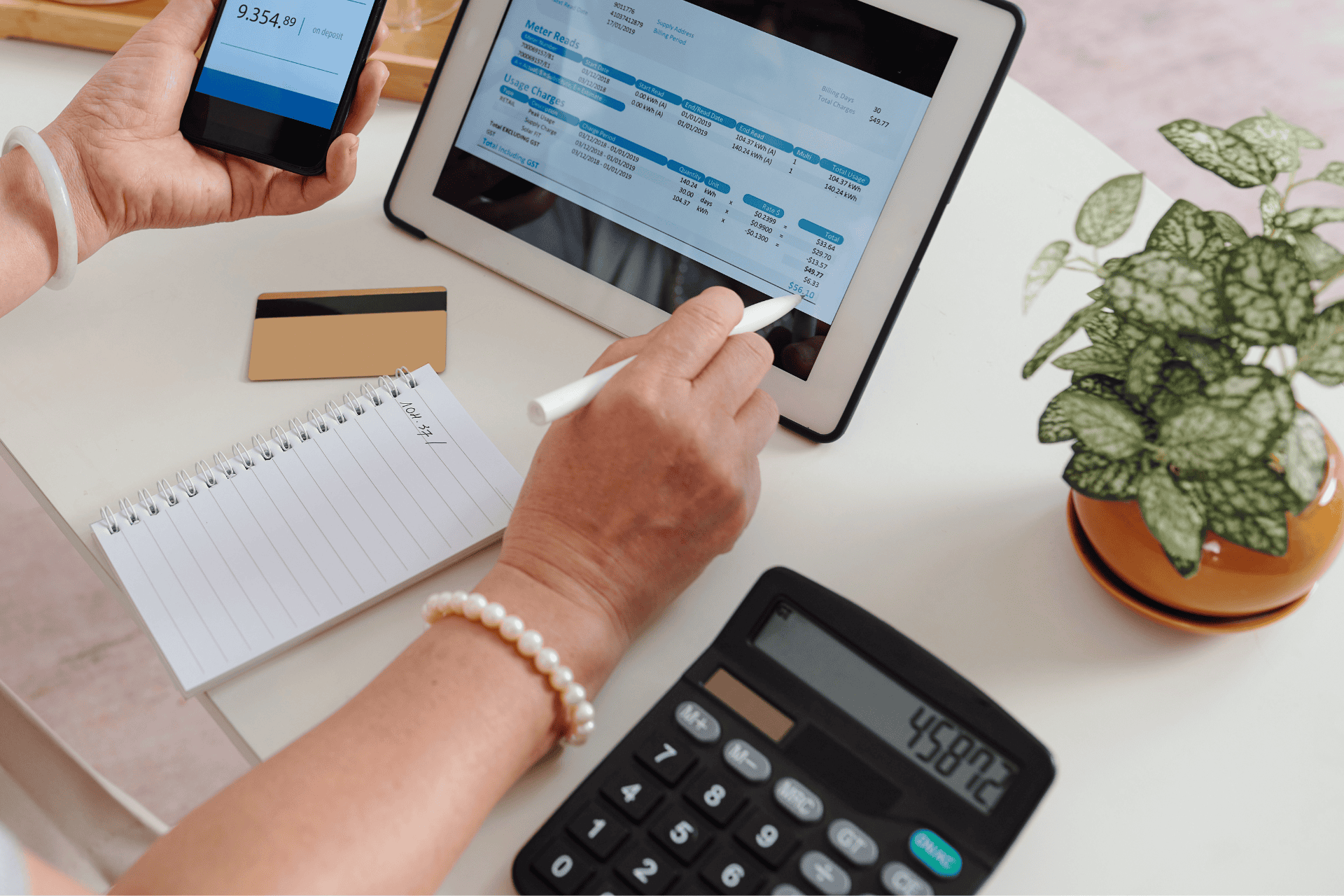 woman-looking-at-utility-bill-with-calculator