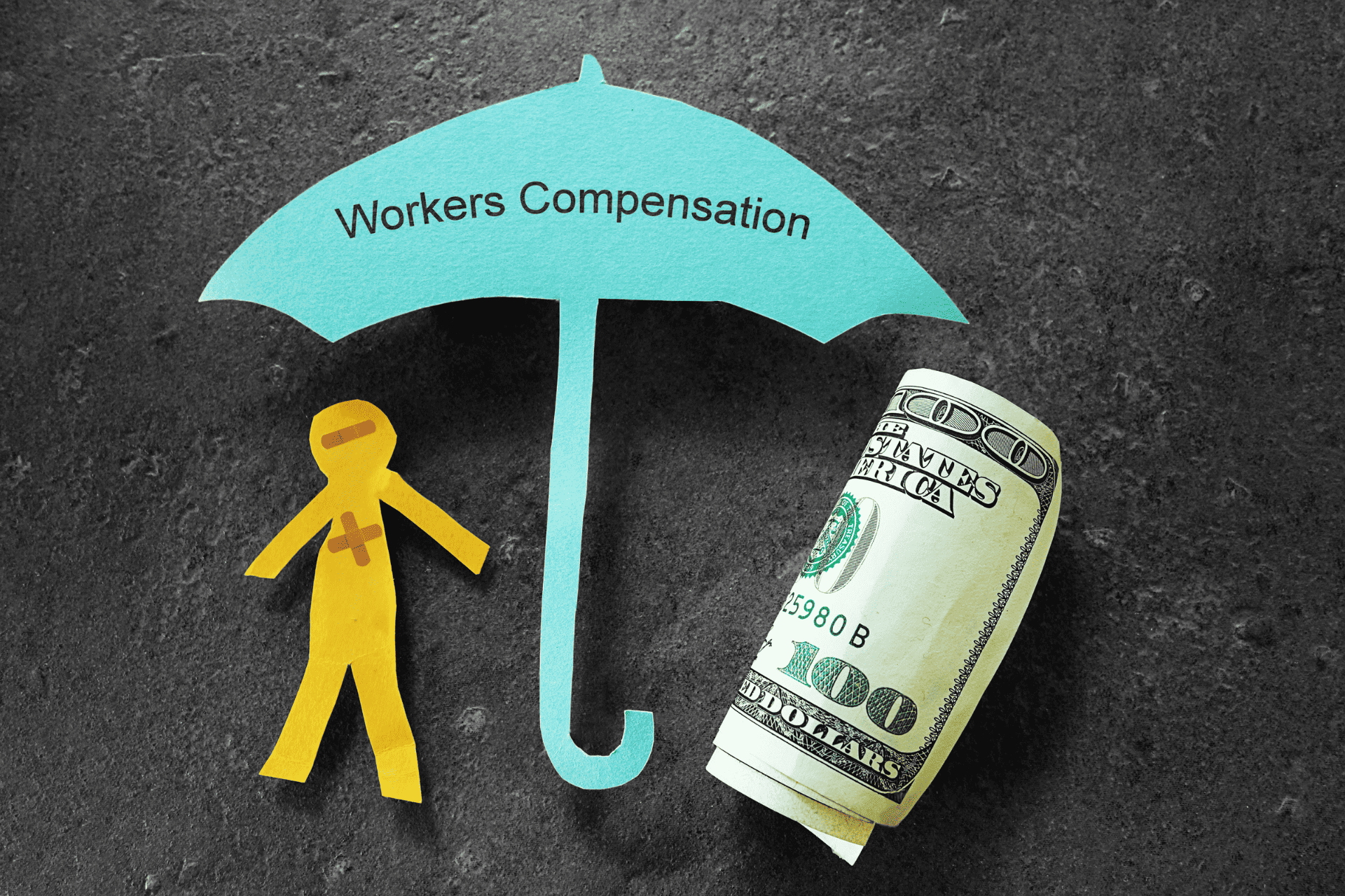 paper-umbrella-over-stick-figure-to-illustrate-workers-comp-insurance